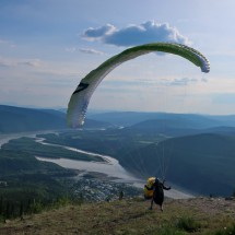 Glider on Midnight Dome with Yukon River and Dawson City